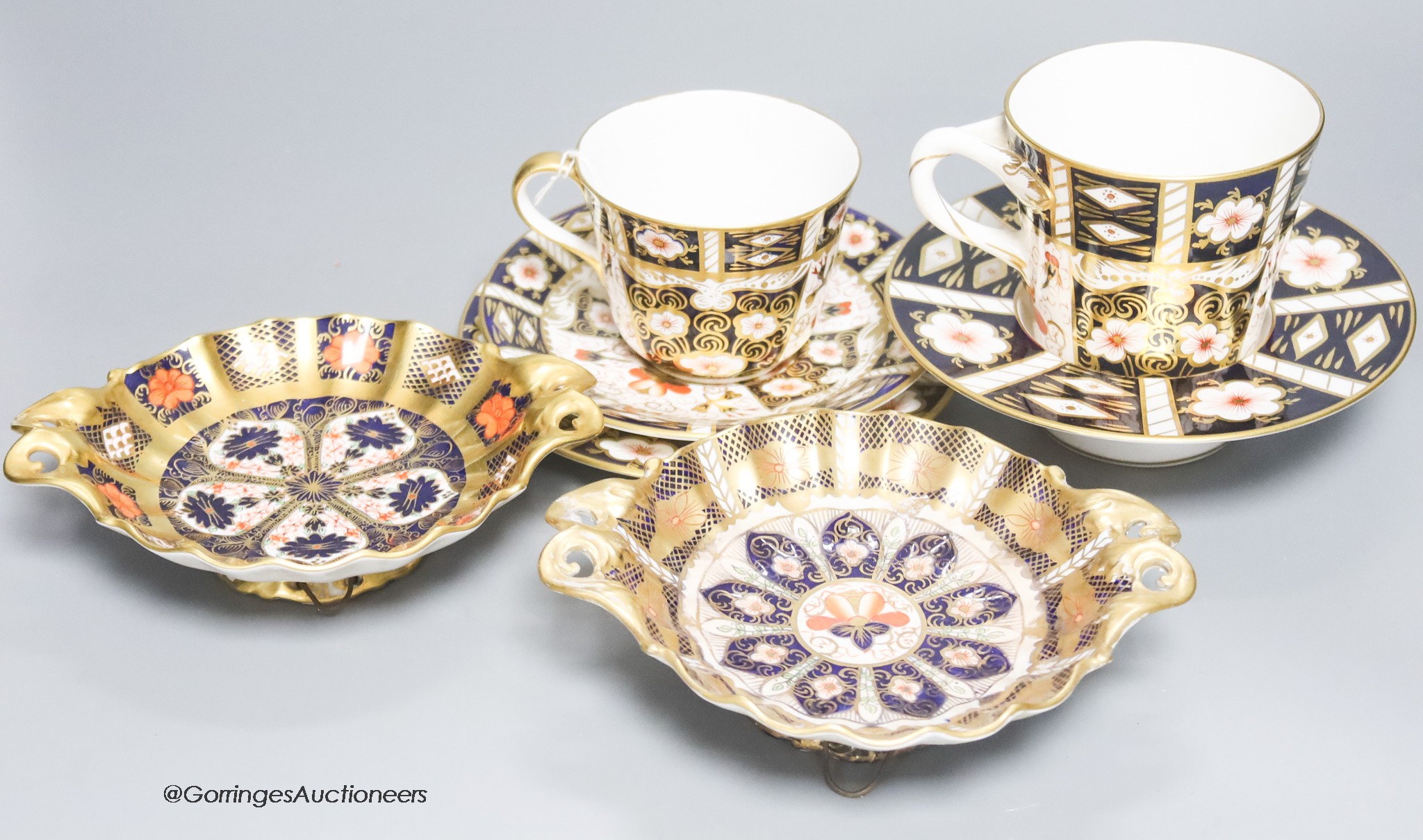 A quantity of Royal Crown Derby cups, plates and dishes